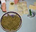 Spinach and meat filling is placed into Won Ton wrappers