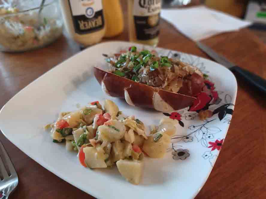 Smoked Bratwurst on a Pretzel Bun, with German Potato Salad 
