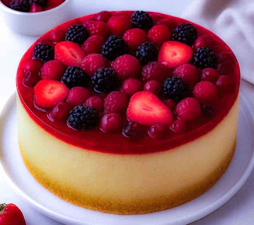 Torte topped with Jellied Rote Gruetze. 