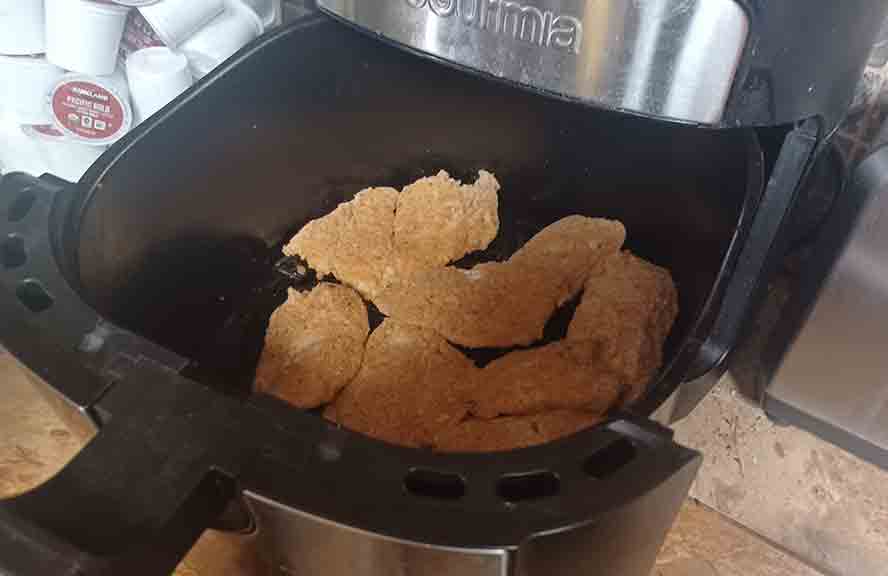 Fish loaded in the air fryer. 
